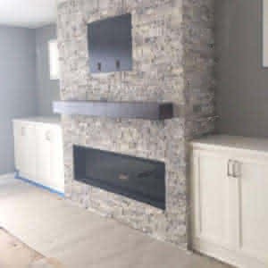 A gray brick fireplace