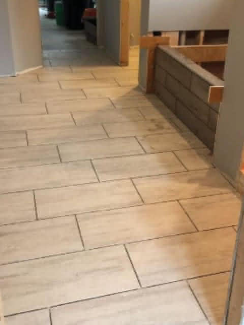 A hallway with tile floors